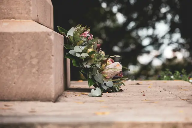 A bouquet of flowers left on a stone step