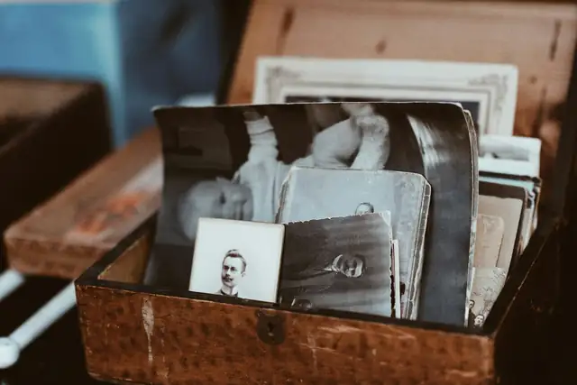 A wooden box full of old family photographs