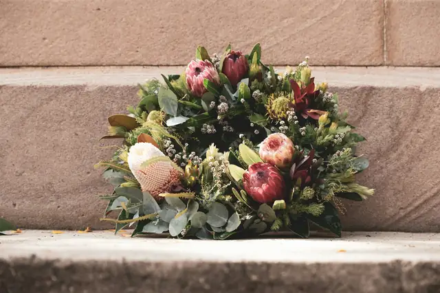 A bouquet of native flowers resting on a stone step